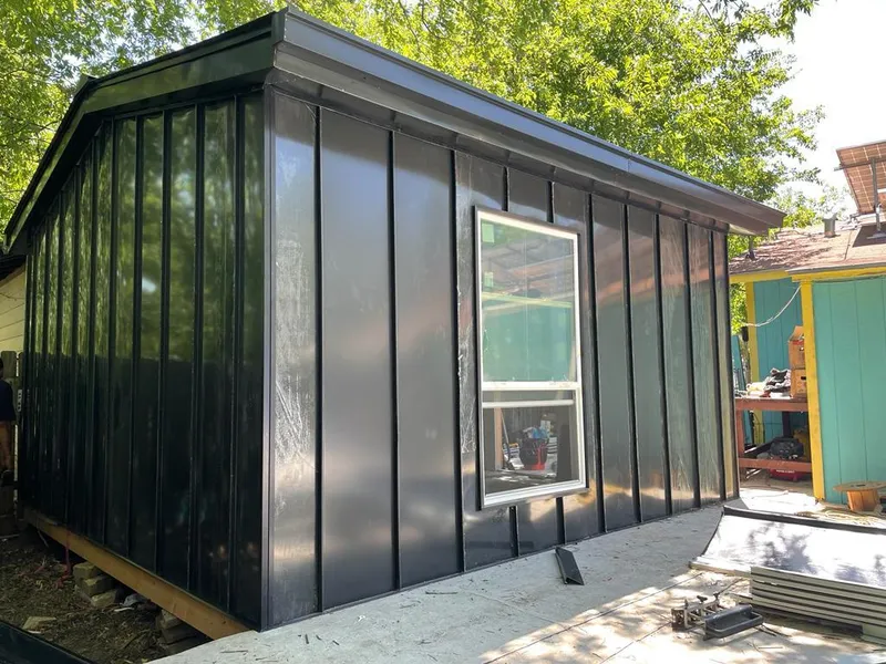 Black standing seam metal wall panels for Roof Inspection in Poteau